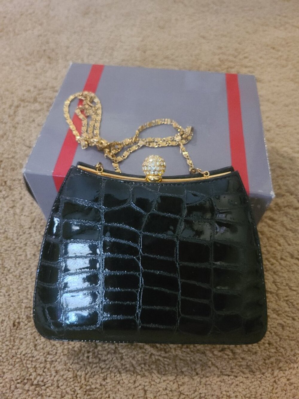 Cleo and Patek black alligator-textured evening clutch